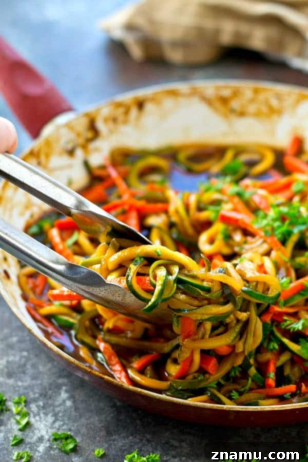 Quick One-Pan Teriyaki Noodles with Vegetables 4 Teriyaki sauce being poured over fresh vegetable noodles