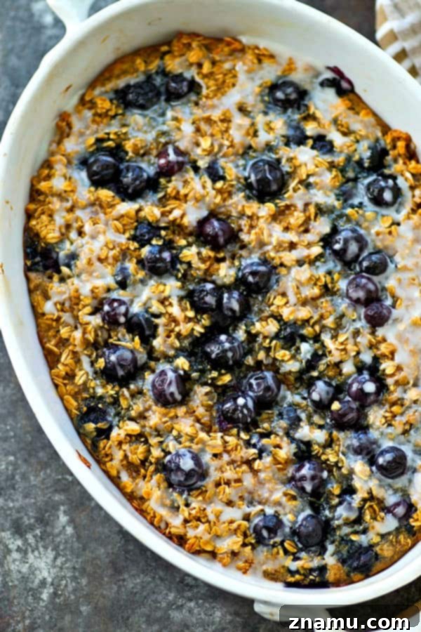 Blueberry Muffin Baked Oats 4 Another enticing view of Glazed Blueberry Muffin Baked Oatmeal in a baking dish