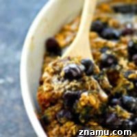 Blueberry Muffin Baked Oats 7 This easy and energy-packed baked oatmeal is loaded full of blueberry muffin goodness and covered in a sweet vanilla glaze. Enjoy it with milk or straight outta the pan!