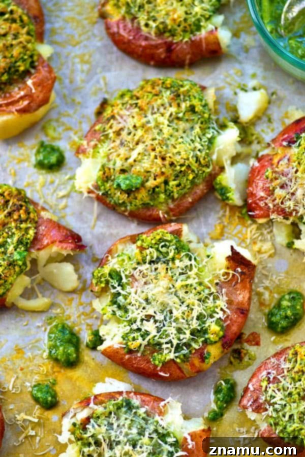 Crispy Parmesan Basil Pesto Smashed Red Potatoes 3 Crispy smashed red potatoes are drizzled in a flavorful basil pesto and topped with lots of Parmesan cheese for an easy and addicting side dish!