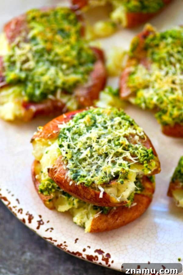 Crispy Parmesan Basil Pesto Smashed Red Potatoes 4 Crispy smashed red potatoes are drizzled in a flavorful basil pesto and topped with lots of Parmesan cheese for an easy and addicting side dish!