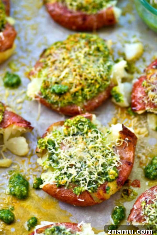 Crispy Parmesan Basil Pesto Smashed Red Potatoes 5 Crispy smashed red potatoes are drizzled in a flavorful basil pesto and topped with lots of Parmesan cheese for an easy and addicting side dish!