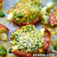 Crispy Parmesan Basil Pesto Smashed Red Potatoes 7 Crispy smashed red potatoes are drizzled in a flavorful basil pesto and topped with lots of Parmesan cheese for an easy and addicting side dish!