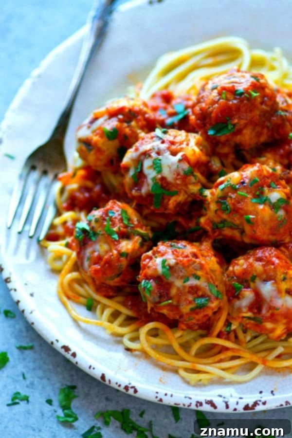 Cheesy Instant Pot Chicken Parmesan Meatballs 3 A close-up of browned chicken meatballs ready for sauce in an Instant Pot, showcasing their golden exterior.
