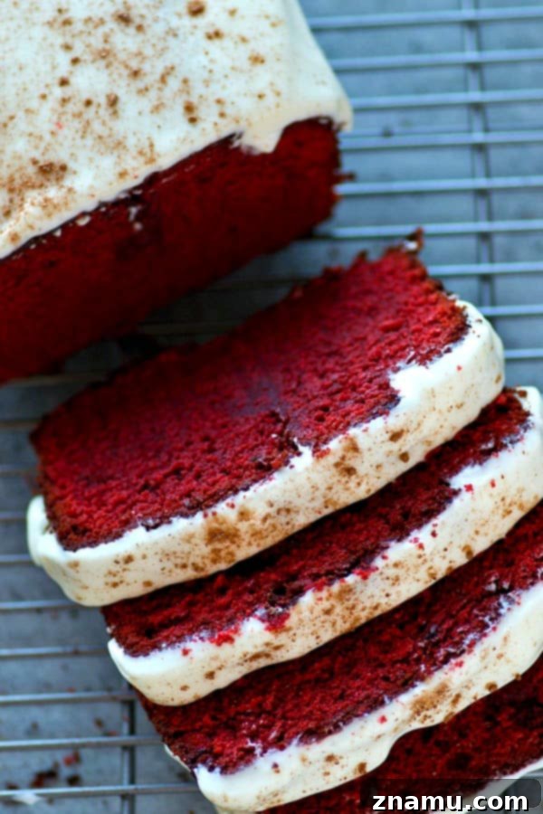 Soft, buttery red velvet pound cake covered in a tangy cream cheese glaze is a breeze to throw together and it's an insanely impressive dessert for any of your loved ones!