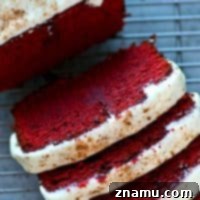 Soft, buttery red velvet pound cake covered in a tangy cream cheese glaze is a breeze to throw together and it's an insanely impressive dessert for any of your loved ones!