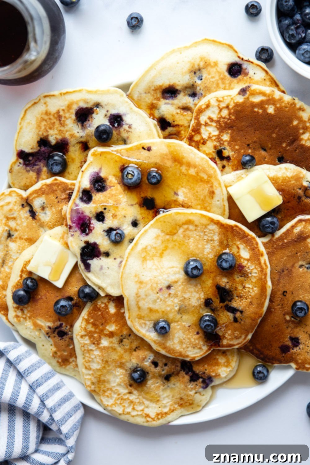 Ultimate Blueberry Buttermilk Pancakes 3 Perfectly thick and fluffy with a tangy buttermilk flavor and lots of juicy blueberries, these blueberry buttermilk pancakes truly are a keeper recipe!