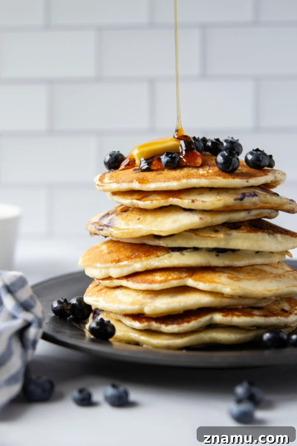 Ultimate Blueberry Buttermilk Pancakes 4 Perfectly thick and fluffy with a tangy buttermilk flavor and lots of juicy blueberries, these blueberry buttermilk pancakes truly are a keeper recipe!