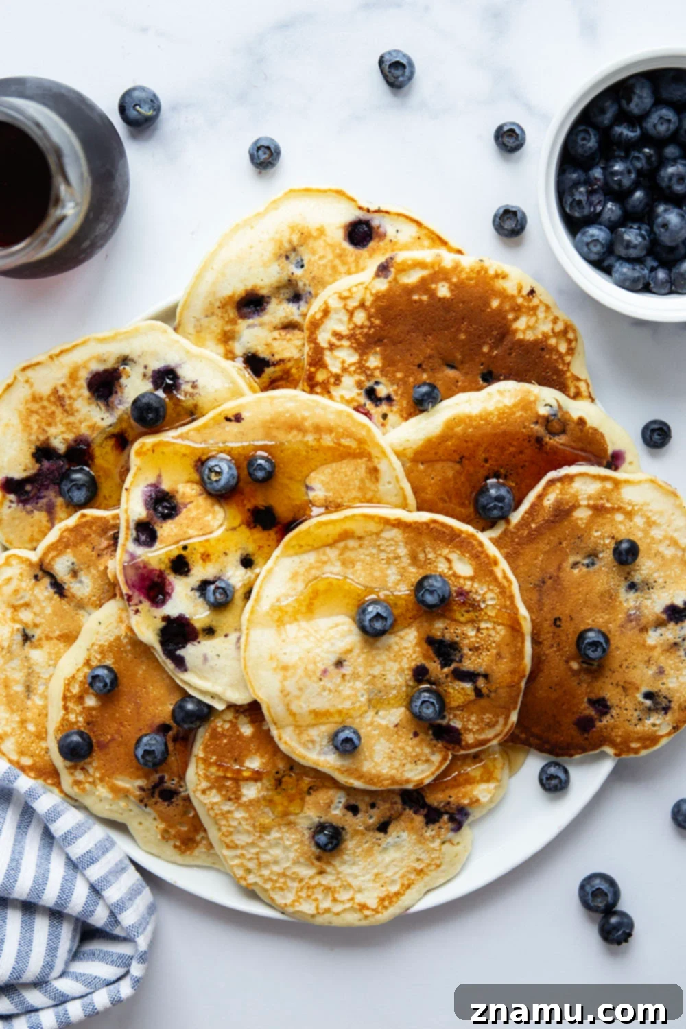 Ultimate Blueberry Buttermilk Pancakes 5 Perfectly thick and fluffy with a tangy buttermilk flavor and lots of juicy blueberries, these blueberry buttermilk pancakes truly are a keeper recipe!