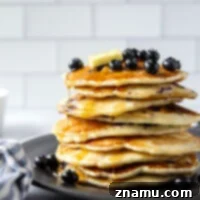 Ultimate Blueberry Buttermilk Pancakes 7 Perfectly thick and fluffy with a tangy buttermilk flavor and lots of juicy blueberries, these blueberry buttermilk pancakes truly are a keeper recipe!