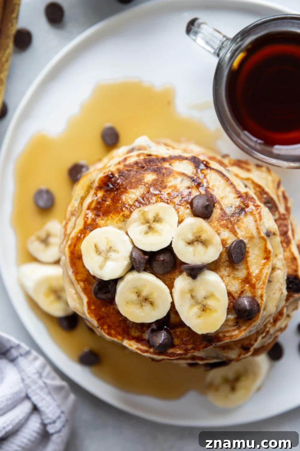 Fluffy Chocolate Banana Bliss 3 Loaded with gooey chocolate chips and lots of banana, these chocolate chip banana pancakes are thick, fluffy, and the ultimate breakfast treat!