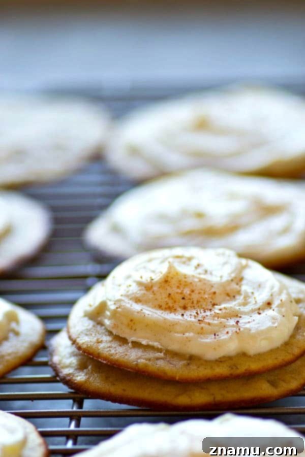 Irresistible Banana Bread Muffin Tops with Cream Cheese Frosting 2 Close-up of golden brown banana bread muffin tops with generous cream cheese frosting