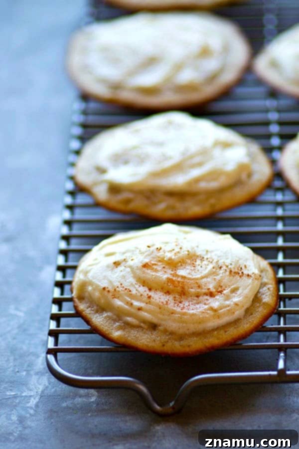Irresistible Banana Bread Muffin Tops with Cream Cheese Frosting 4 Stacked banana bread muffin tops with rich cream cheese frosting