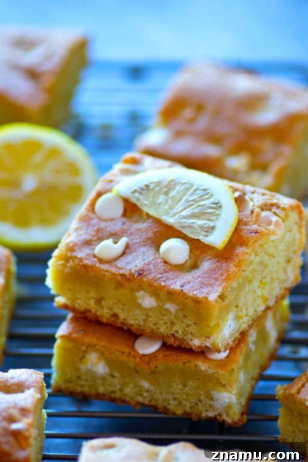 White Chocolate Lemon Blondies baking in a square pan, edges slightly golden.