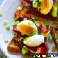 Soft Boiled Egg and Bacon Avocado Toast 7 Piled high with beautiful soft-boiled eggs and lots of crispy bacon, this bacon avocado toast is an absolute BREEZE to throw together and the ultimate stunner breakfast!