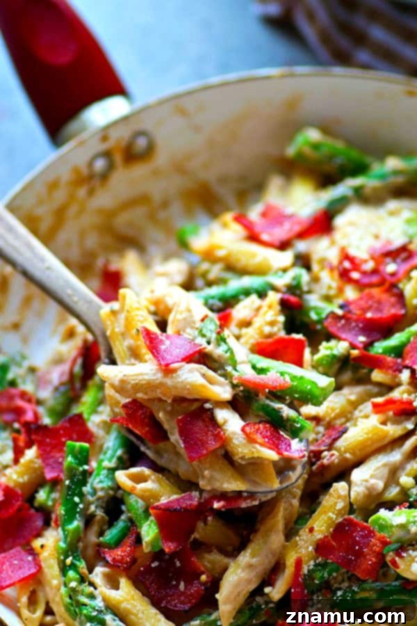 Close-up of Asparagus Bacon Browned Butter Alfredo Penne in a pan