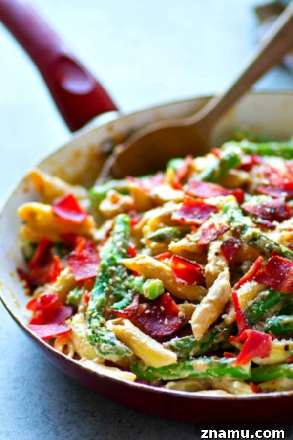 Plated Asparagus Bacon Browned Butter Alfredo Penne with fresh parsley