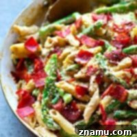 Flavorful browned butter and tons of asparagus and crispy bacon transform this creamy alfredo penne into a KILLER spring side dish that will quickly become a dinner regular.