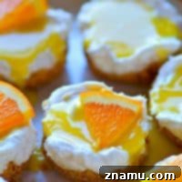 Tangy Orange No-Bake Cheesecake Bites 7 These creamy orange curd mini cheesecakes are completely no-bake and can be prepped within minutes! A tangy homemade orange curd on top makes them irresistible.