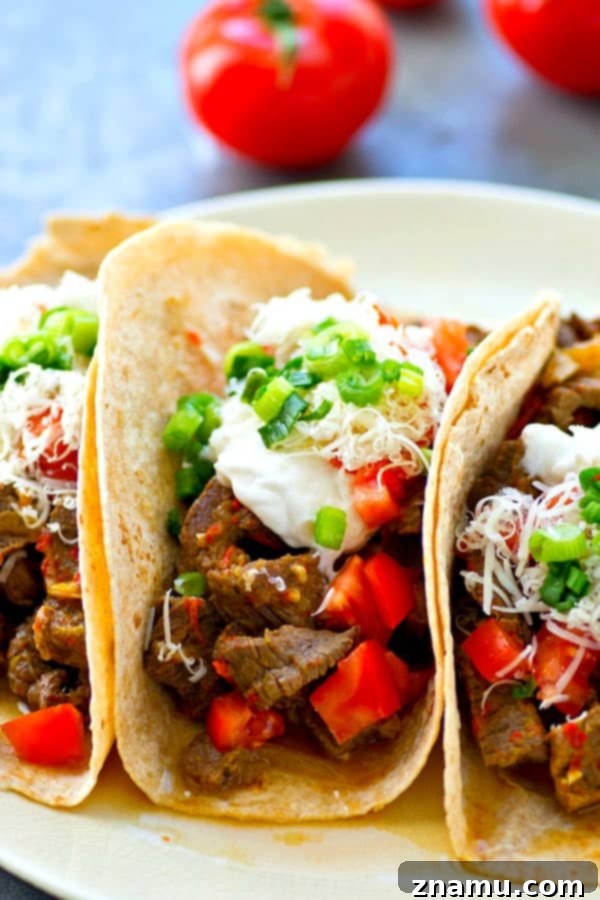 Instant Pot Fiery Beef and Bell Pepper Fajitas 3 Close-up of succulent spicy beef and brightly colored sweet peppers in the Instant Pot.