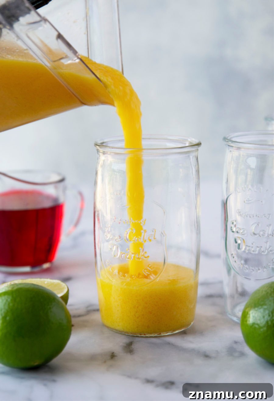 Spiked Sunrise Slush 4 These tequila sunrise slushies are a frozen twist off of the classic cocktail and they're SO easy to blend up!