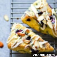 Creamy Blueberry Almond Scones 7 Flaky Blueberries 'n' Cream Almond Scones with a thick vanilla glaze
