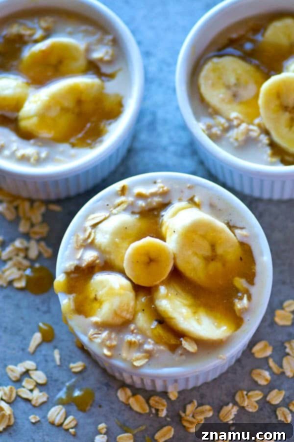 Close-up of Caramel Macchiato Banana Overnight Oats in a glass jar, showcasing the distinct layers of oats, coffee-infused creaminess, and banana slices.