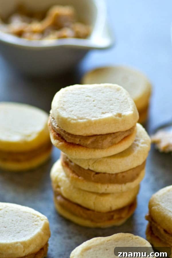 Vanilla Wafer Caramel Delights 5 A tall, artfully arranged tower of vanilla wafer caramel sandwich cookies, showcasing the bounty of the recipe