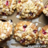 Packed with juicy cranberries and baked with a buttery oatmeal streusel on top, these cranberry oatmeal muffins are a holiday breakfast favorite!