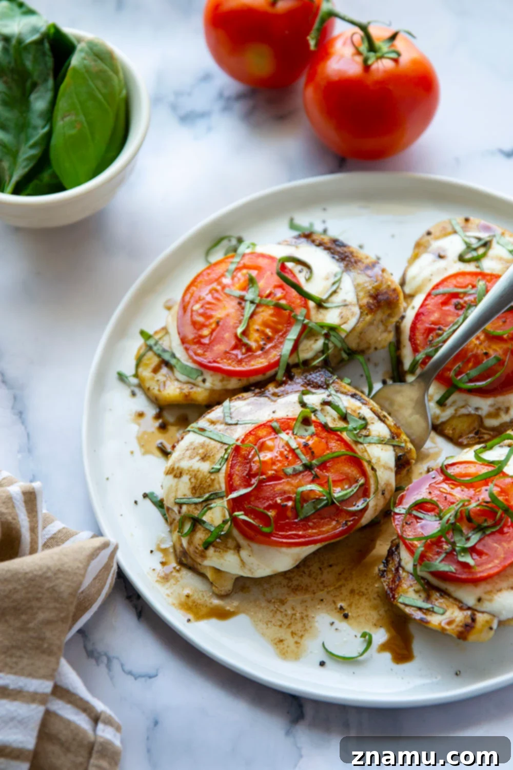 Grilled Caprese Chicken 5 This grilled chicken margherita features grilled chicken topped with fresh mozzarella, juicy tomato slices, and lots of fresh basil and balsamic glaze.