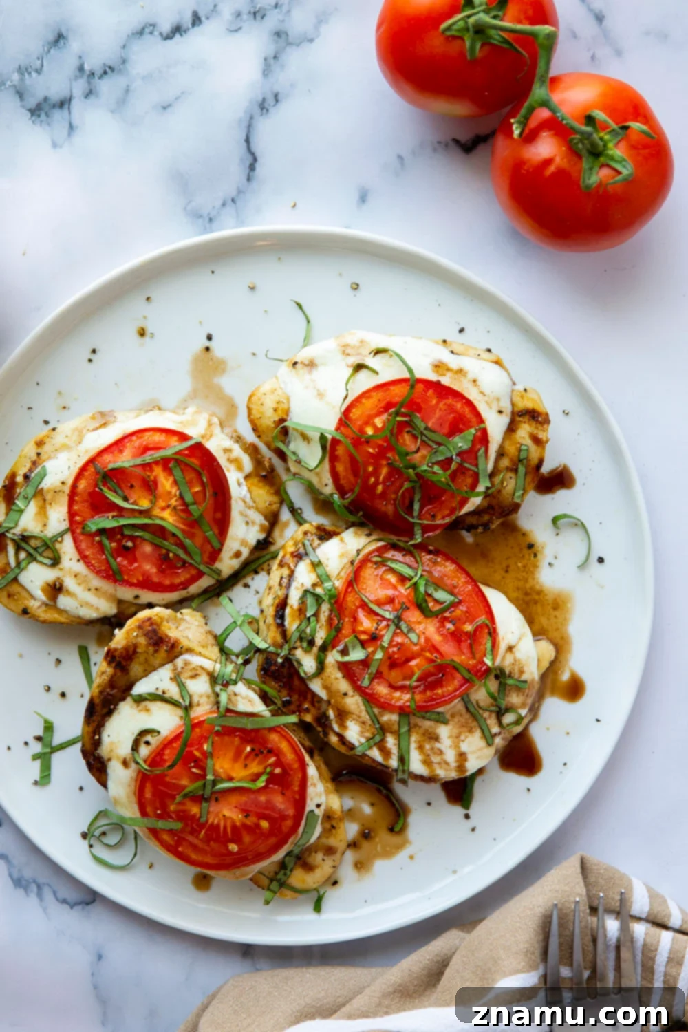 Grilled Caprese Chicken 6 This grilled chicken margherita features grilled chicken topped with fresh mozzarella, juicy tomato slices, and lots of fresh basil and balsamic glaze.