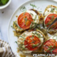 Grilled Caprese Chicken 8 This grilled chicken margherita features grilled chicken topped with fresh mozzarella, juicy tomato slices, and lots of fresh basil and balsamic glaze.