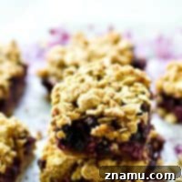 A juicy blueberry filling and oatmeal cookie-like streusel topping makes these blueberry oatmeal cookie streusel pie bars a perfect no-fuss summer dessert, snack, or even breakfast!