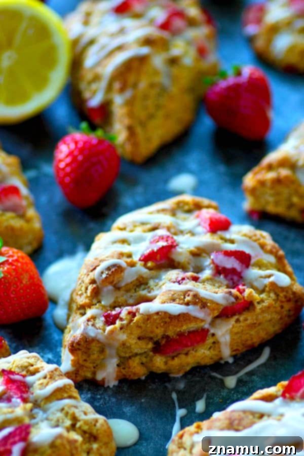 Tangy Strawberry Lemon Scones 2 Deliciously flaky strawberry lemonade scones with a tangy lemon glaze, perfect for a summer brunch.