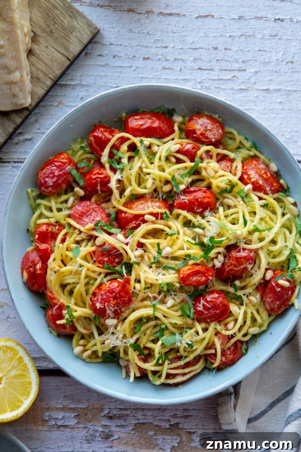 Lemon-Kissed Basil Pesto Spaghetti with Sweet Burst Tomatoes 3 This lemon basil pesto spaghetti features flavorful homemade lemon basil pesto and juicy bursting cherry tomatoes. - a perfect summer side dish with grilled meat!