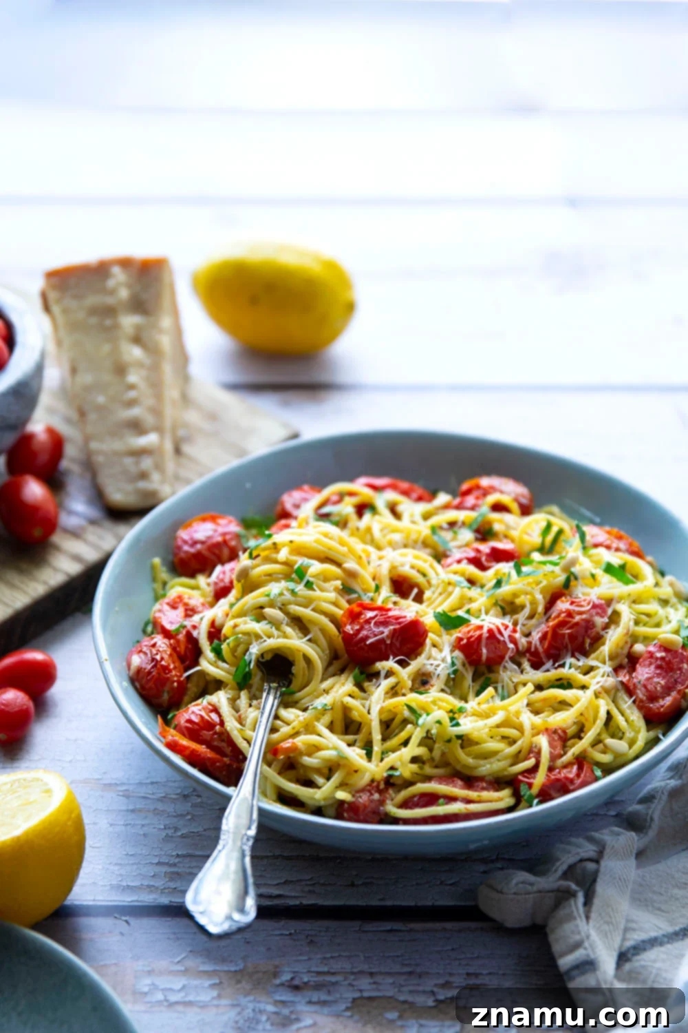 Lemon-Kissed Basil Pesto Spaghetti with Sweet Burst Tomatoes 4 This lemon basil pesto spaghetti features flavorful homemade lemon basil pesto and juicy bursting cherry tomatoes. - a perfect summer side dish with grilled meat!