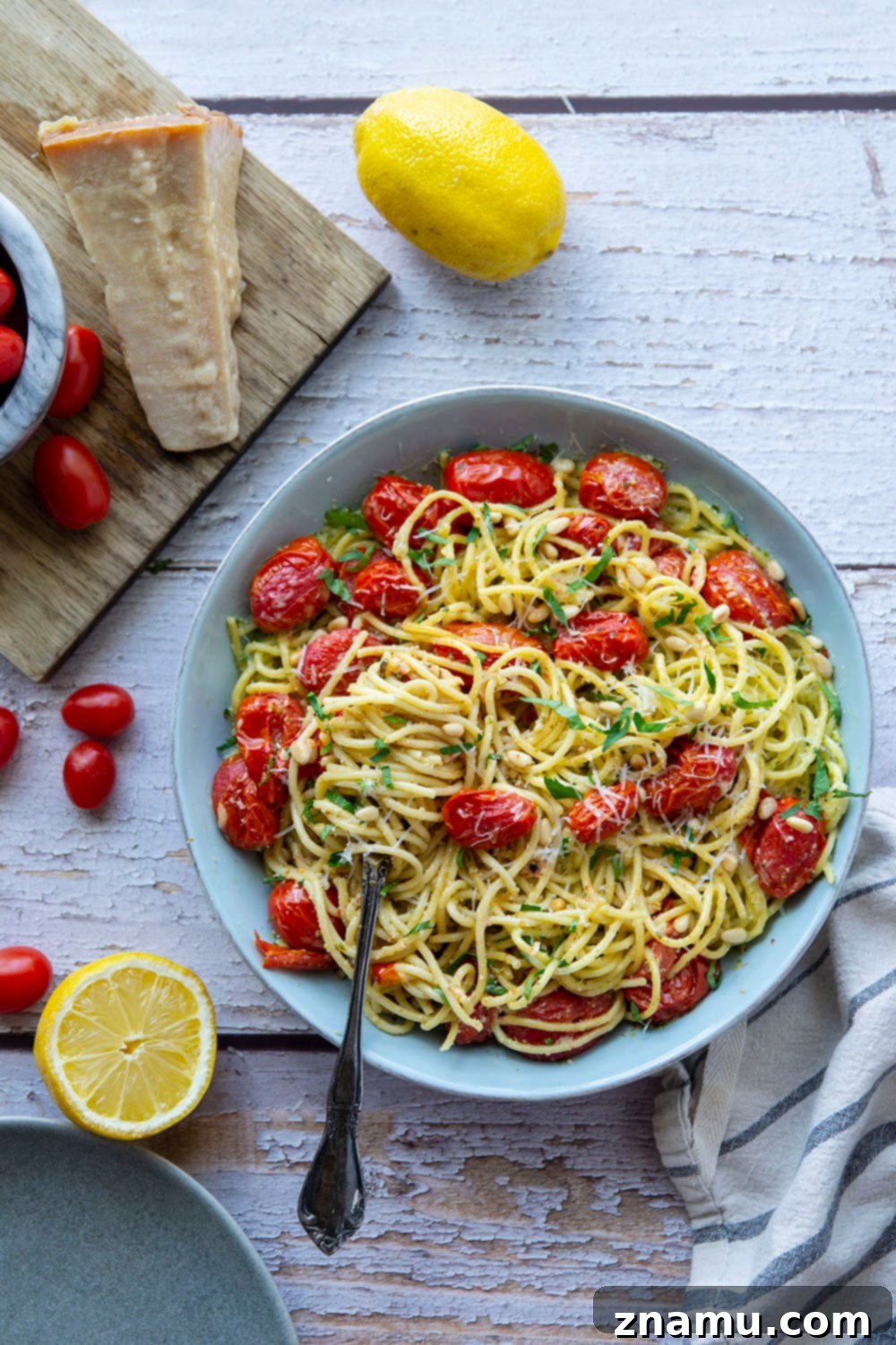 Lemon-Kissed Basil Pesto Spaghetti with Sweet Burst Tomatoes 5 This lemon basil pesto spaghetti features flavorful homemade lemon basil pesto and juicy bursting cherry tomatoes. - a perfect summer side dish with grilled meat!