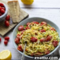 Lemon-Kissed Basil Pesto Spaghetti with Sweet Burst Tomatoes 8 This lemon basil pesto spaghetti features flavorful homemade lemon basil pesto and juicy bursting cherry tomatoes. - a perfect summer side dish with grilled meat!