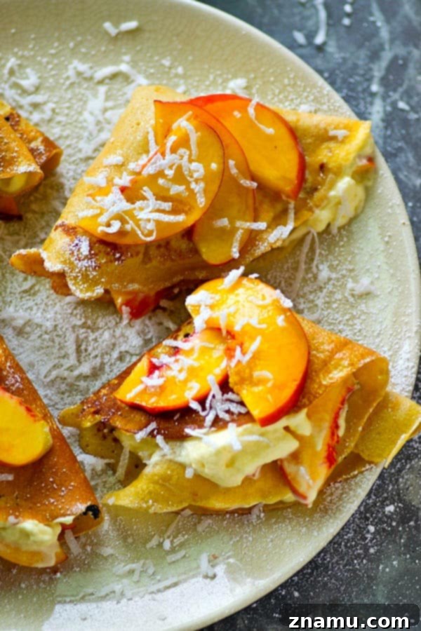 Creamy Peach Coconut Crepes 5 Delectable coconut crepes folded into quarters with peaches and cream spilling out