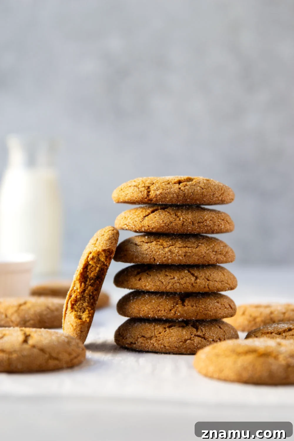 Zingy Gingersnap Crunch 2 Perfectly thin and crispy gingersnap cookies with crackled tops on a cooling rack