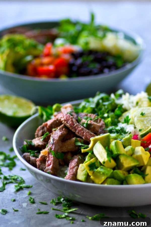 Juicy, flavorful cilantro lime grilled steak and all the burrito 'fixins come together in these loaded grilled steak burrito bowls and it'll be on the table in only an hour!