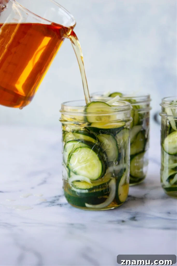 No-Canning Overnight Bread and Butter Pickles 5 Thinly sliced cucumbers and onions ready for making homemade refrigerator pickles.