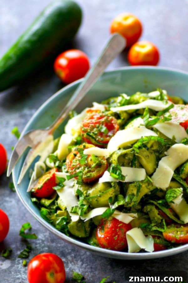 Smooth, garlicky roasted garlic spinach pesto coats every inch of this summery zucchini ribbon salad and it's all tossed with tons of juicy cherry tomatoes and grated Parmesan.