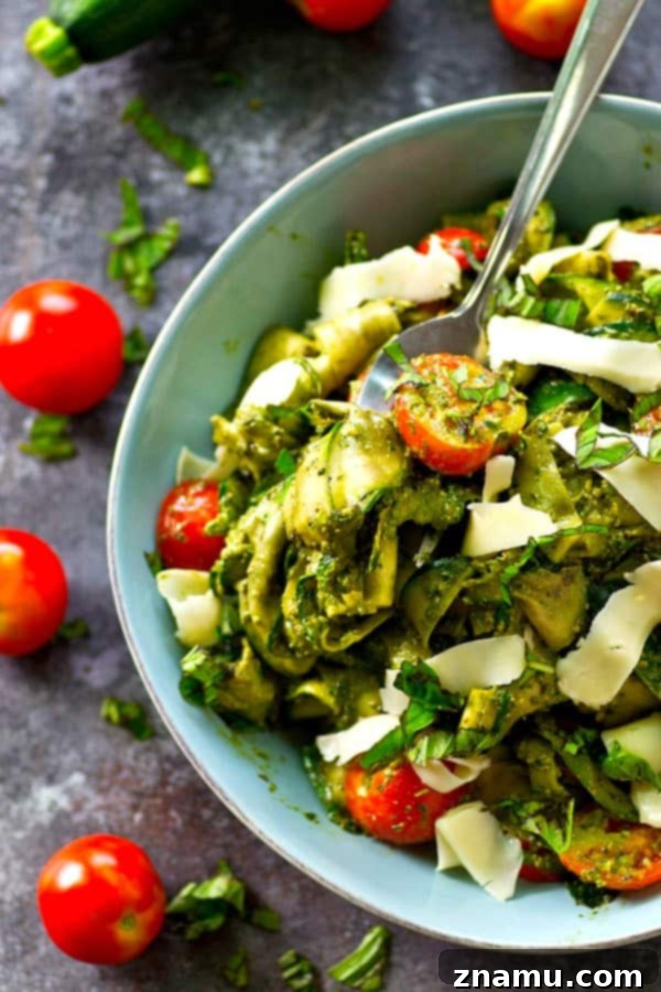 Smooth, garlicky roasted garlic spinach pesto coats every inch of this summery zucchini ribbon salad and it's all tossed with tons of juicy cherry tomatoes and grated Parmesan.