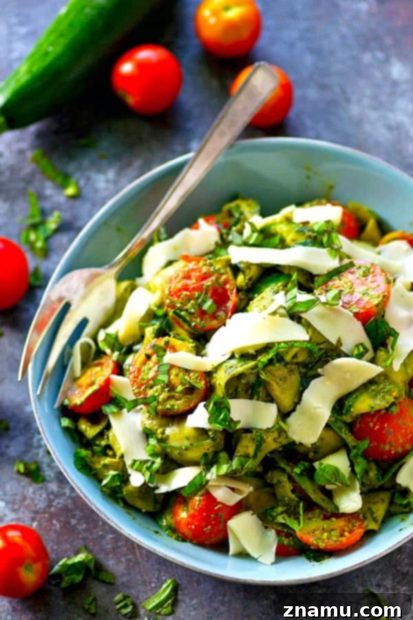 Smooth, garlicky roasted garlic spinach pesto coats every inch of this summery zucchini ribbon salad and it's all tossed with tons of juicy cherry tomatoes and grated Parmesan.