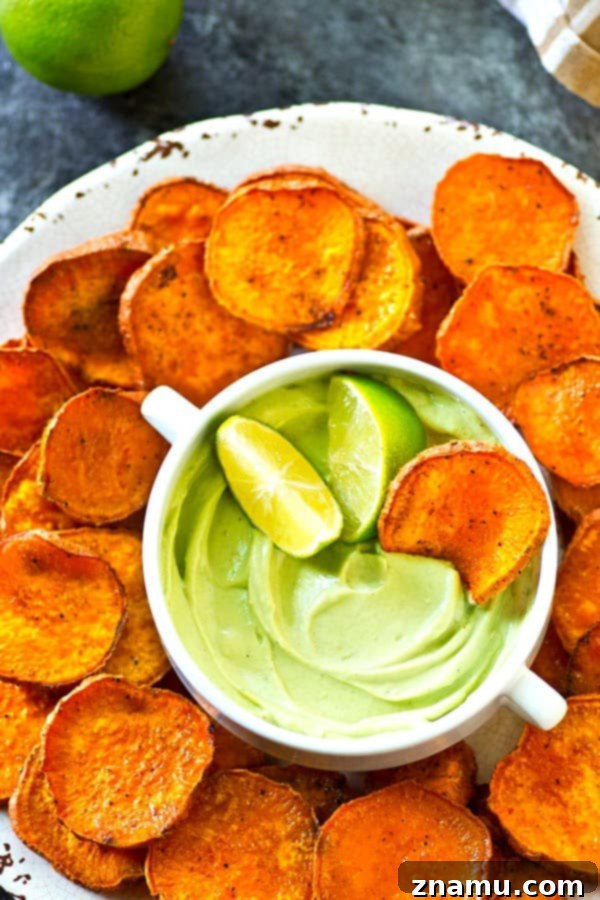 Kickin' Cajun Lime Sweet Potato Chips are perfectly crisp with just the right amount of heat and cooled down with a creamy avocado dip.--just try to eat only one!