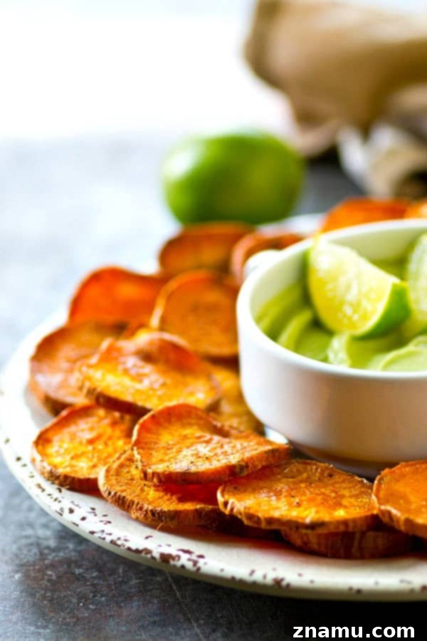 Kickin' Cajun Lime Sweet Potato Chips are perfectly crisp with just the right amount of heat and cooled down with a creamy avocado dip.--just try to eat only one!
