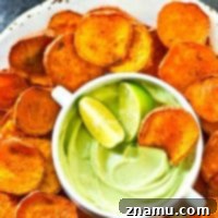 Kickin' Cajun Lime Sweet Potato Chips are perfectly crisp with just the right amount of heat and cooled down with a creamy avocado dip.--just try to eat only one!