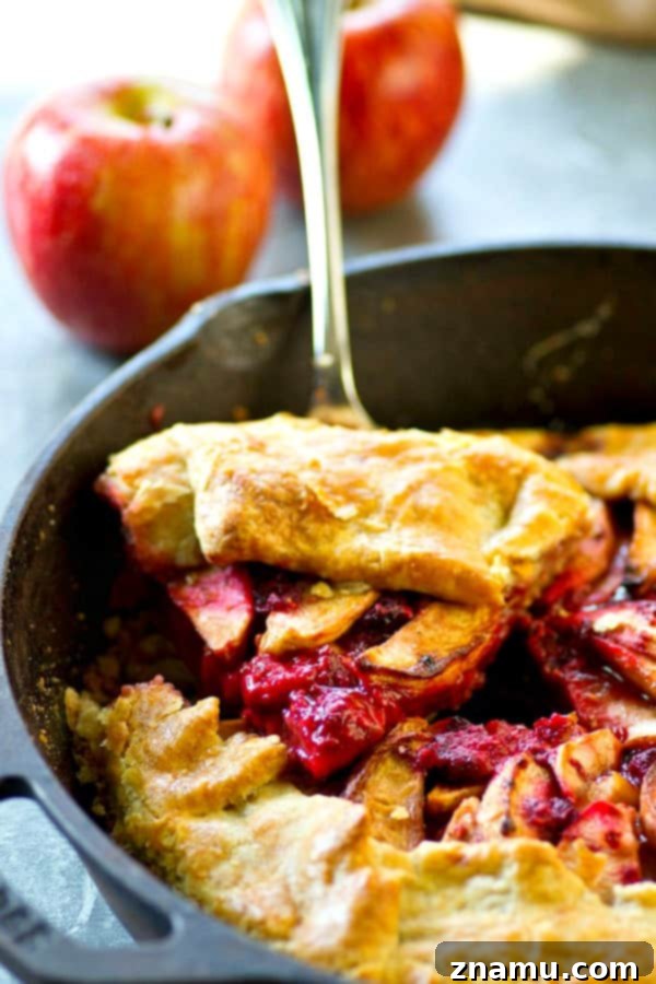Sweet & Tart Skillet Apple Raspberry Galette 5 Warm slice of apple raspberry galette with flaky crust