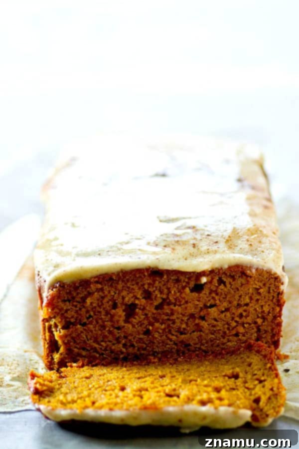 Nutty Brown Butter Pumpkin Loaf with Creamy Glaze 5 Beautifully frosted slices of Browned Butter Pumpkin Bread on a rustic serving board